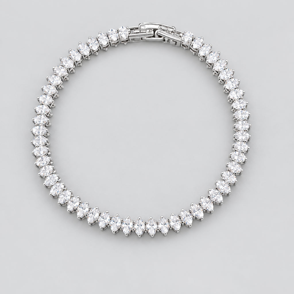 Silver bracelet with clear stones on a black background