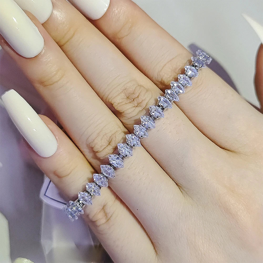 Diamond bracelet on a hand with a neutral background