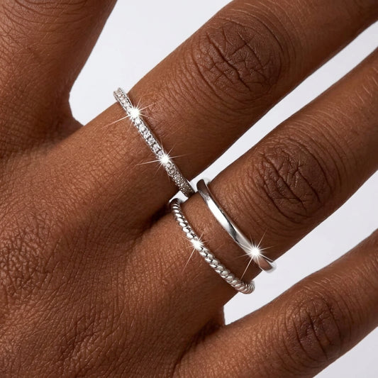 Two silver rings on a finger with a 'Real High Quality 925 Silver Plated' badge.